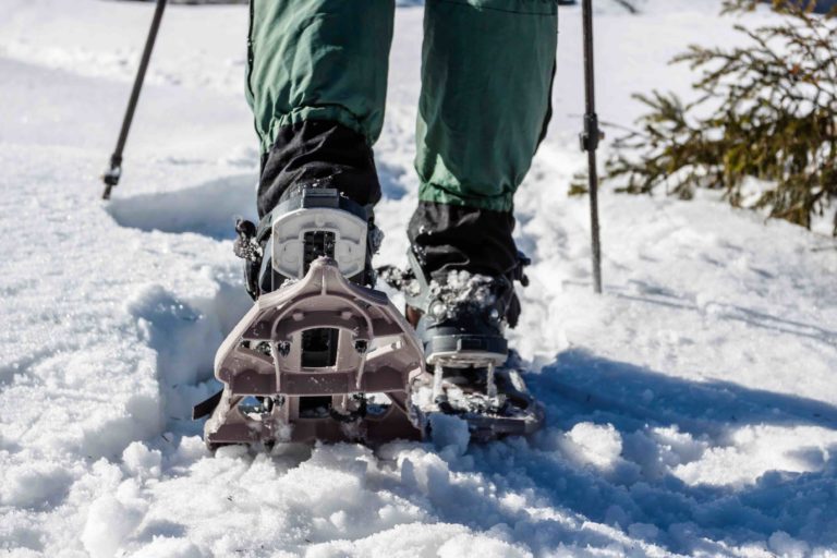 winter snowshoeing on a trail in bozeman montana