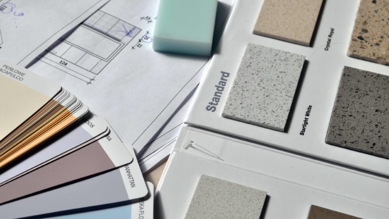 paint and countertop material samples for indoor winter home renovations - ami sayer real estate